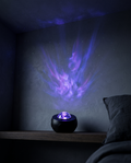 Nebula Projector casting violet nebula across a dark bedroom wall