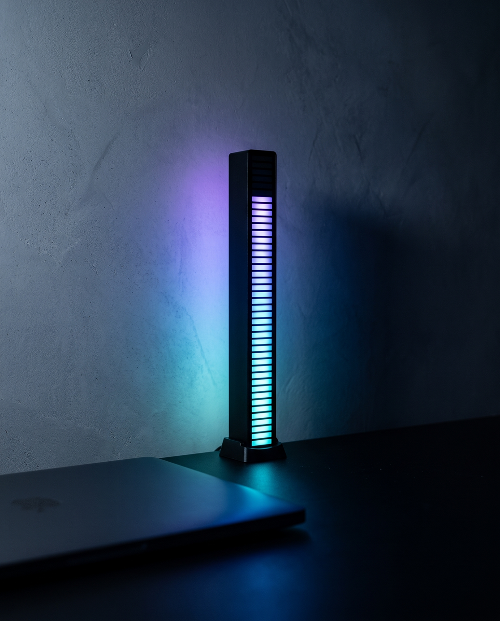 Pulse Light Bar lit cyan and violet on a dark desk