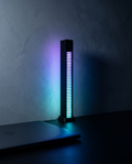 Pulse Light Bar lit cyan and violet on a dark desk