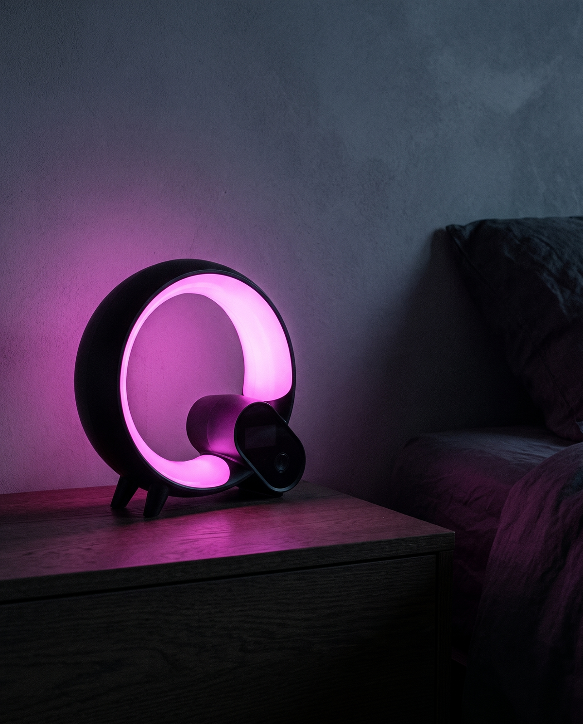 Sunrise Alarm Light glowing magenta on a nightstand