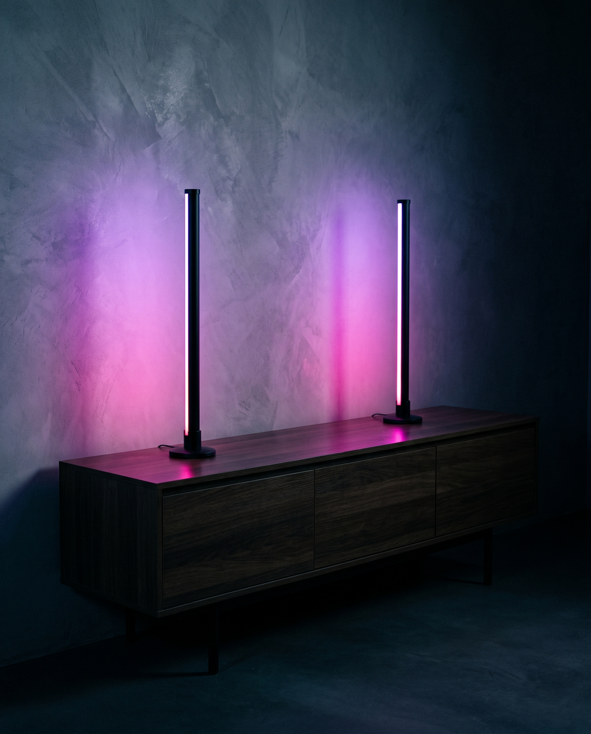 Two RGB Light Bars glowing magenta on a sideboard
