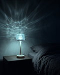 Wave Projector casting rippling cyan light across a bedroom wall