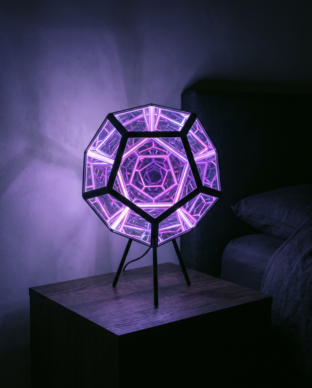 Infinity Dodecahedron glowing violet on a bedside table