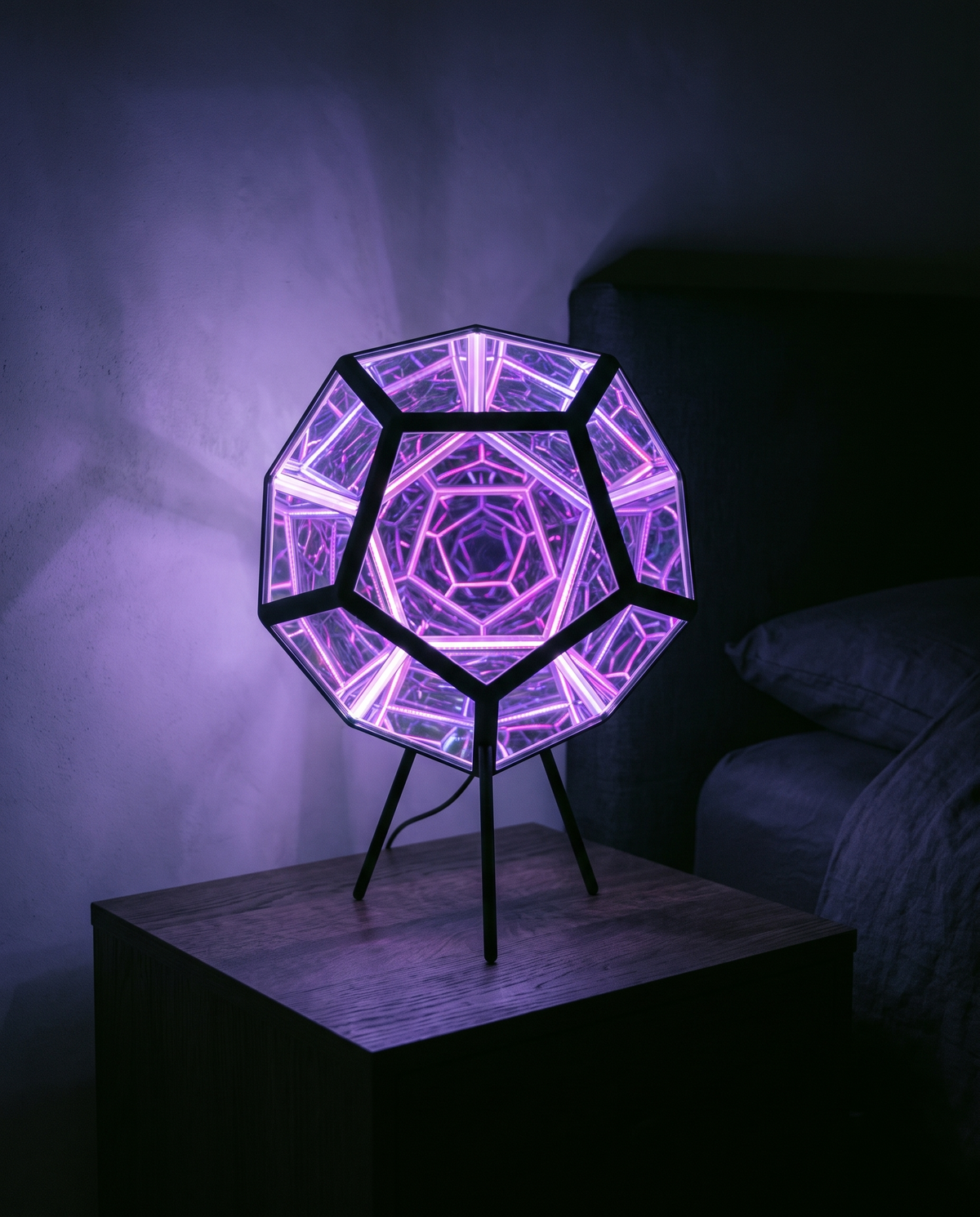 Infinity Dodecahedron glowing violet on a bedside table